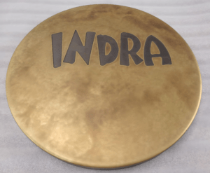 Round brass table top egraved with INDRA