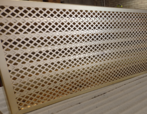 Decorative brass grille panel — geometric pattern