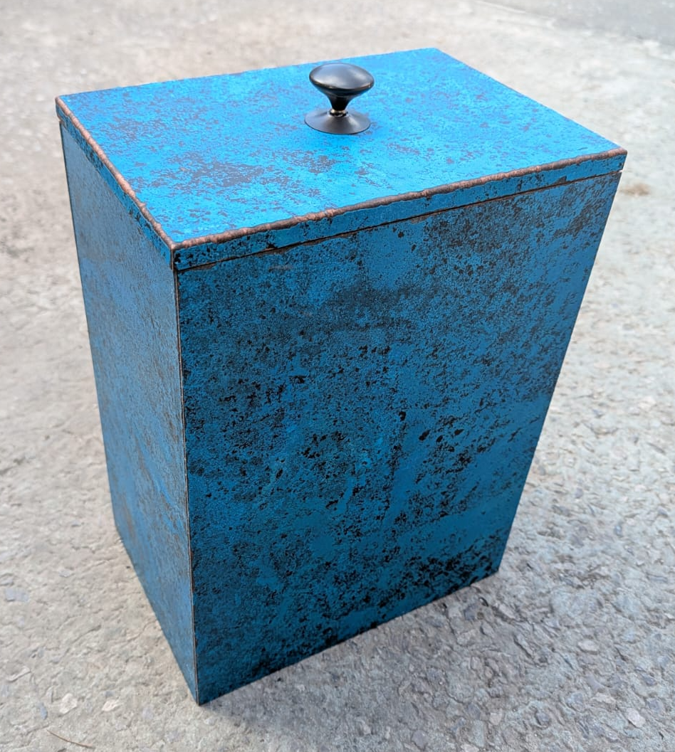 Bespoke timber storage box clad in blue patina copper with brass lift handle