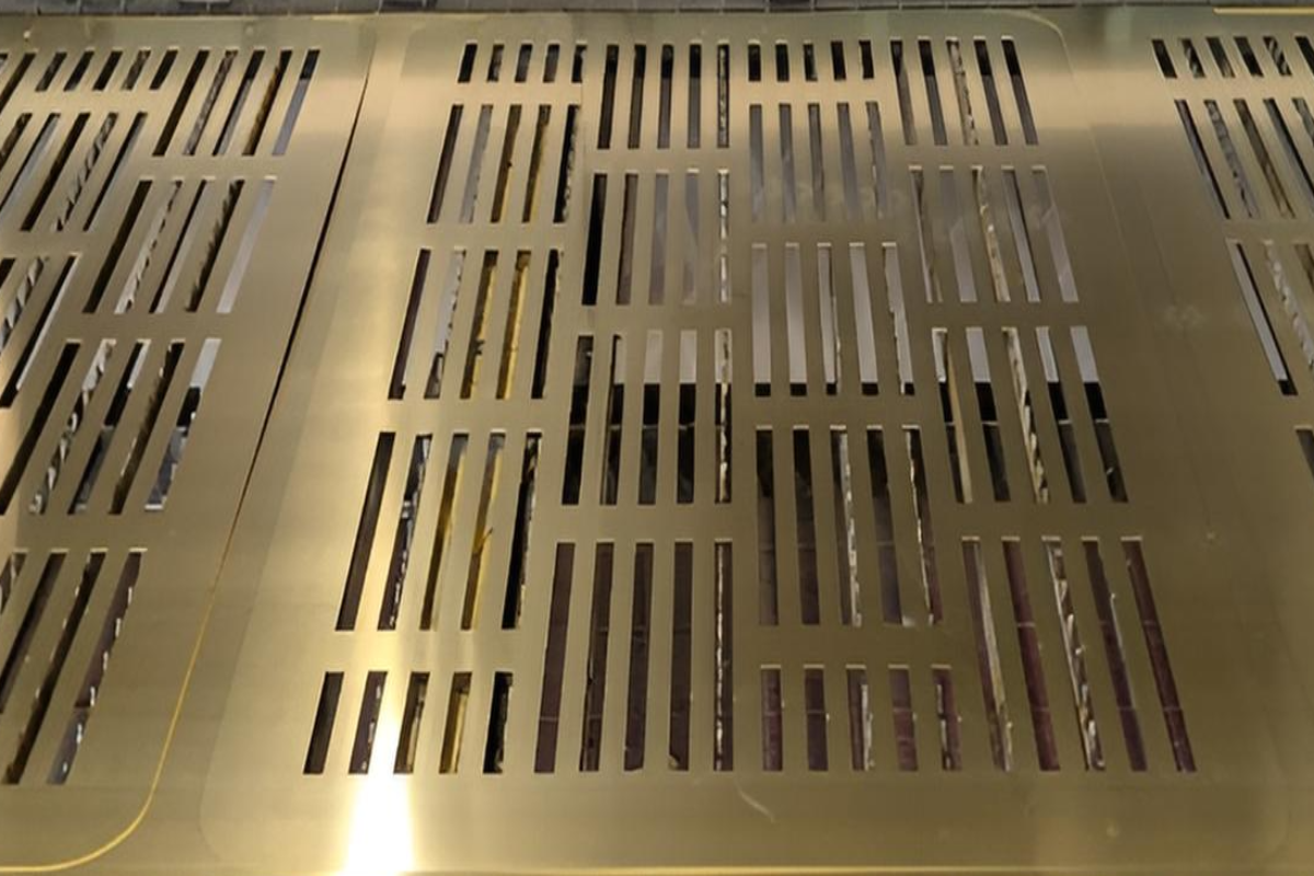 Brass ventilation panel with rectangular perforations