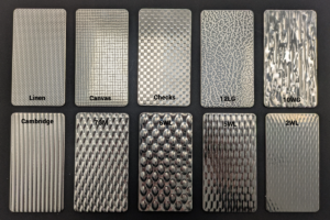 Collection of premium decorative stainless steel sheet finishes including 5WL, 6WL, 10WG, Canvas, Checks, and Cambridge patterns for architectural and interior design use.
