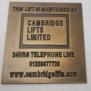 Antique brass vintage metal signage for Cambridge Lifts with deep engraved lettering