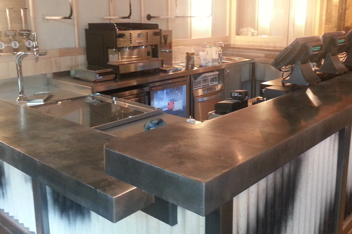 Bespoke zinc service counter and bar preparation area for a hospitality interior