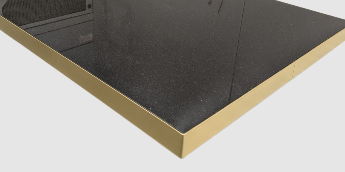Black stone table top with brass edge trim and square corner