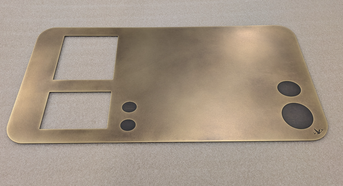 Bespoke antique brass Grey Goose drinks cart panel with precision-cut openings and rounded corners